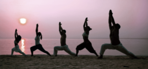 yoga-group-beach-sunset