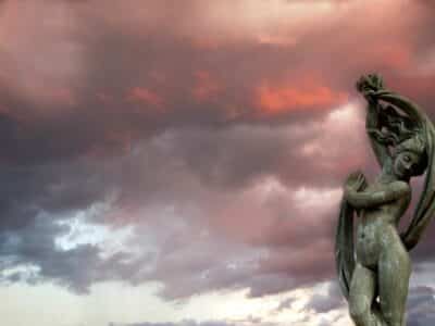 venus statue under cloudy sky during sunset